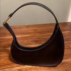 Madison West Black Crescent Shoulder Bag with Gold Accent